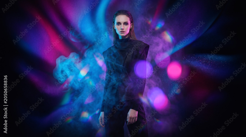 Obraz premium A vibrant cool abstract background featuring a seamless, soft gradient blend of luminous neon electric blue, radiant magenta, and deep cosmic indigo, transitioning fluidly from a pure solid black base