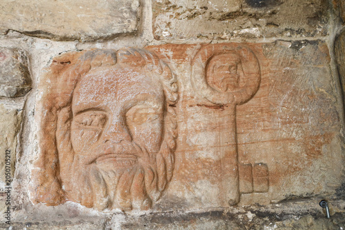 Carved stone faces and symbols in St Nicholas of Bari church in the old town of Aviles city, Asturias