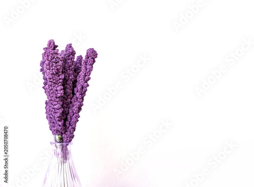 Konstfotografi Crocheted lavender in a vase against a white background