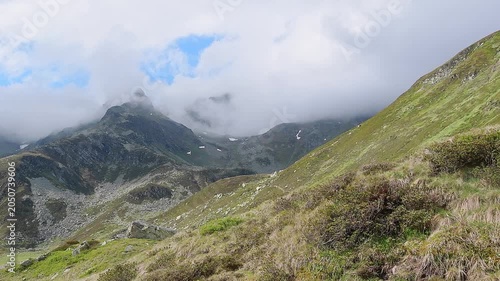 Schwarzhorn wrapped by fogs, Pizzo Suretta landscape in the Montespluga range