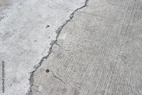 Cracked and damaged concrete road background