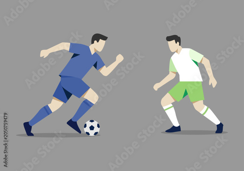 Fotografie Dos jugadores de fútbol compitiendo por el balón