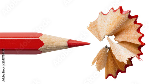 Photos Red colored pencil with sharp point and wood shavings