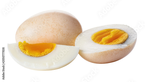 Obraz na plátně Whole and halved hard-boiled eggs with bright yellow yolks