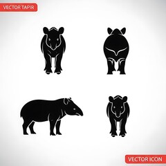 Four black dog silhouettes standing and sitting.