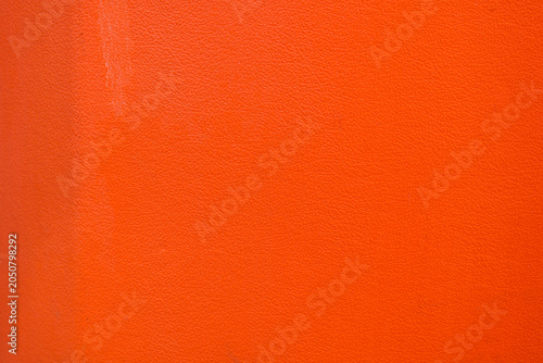 A solid orange synthetic material surface.