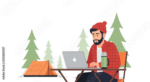 Man working on laptop in forest campsite with tent and thermos