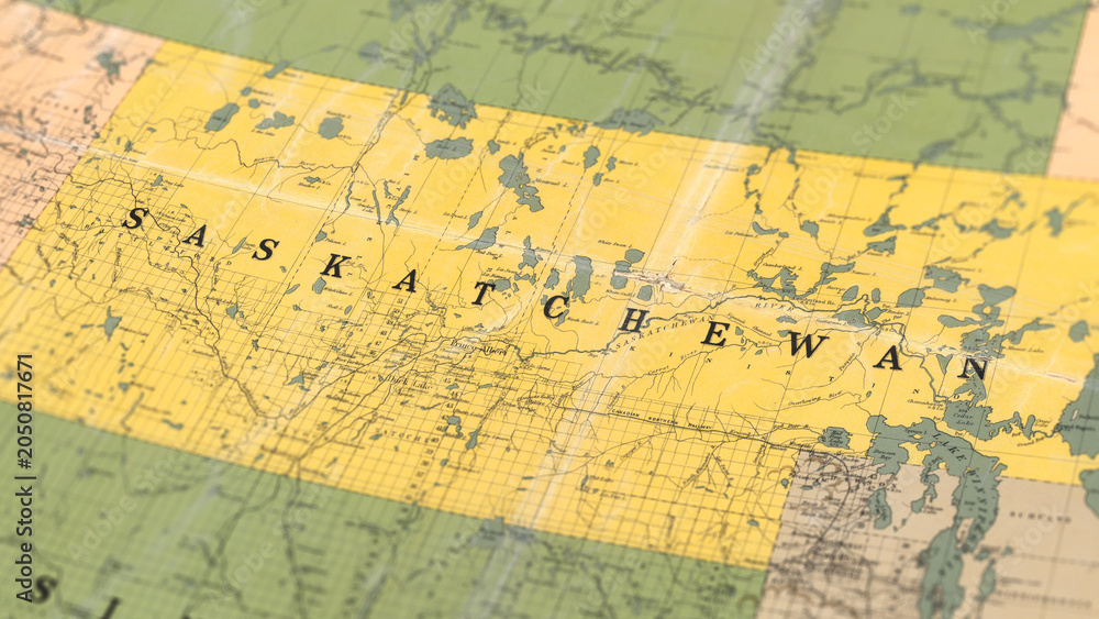 Fototapeta premium Macro View of Vintage Map Highlighting Saskatchewan Canada with Detailed Geographic Cartography