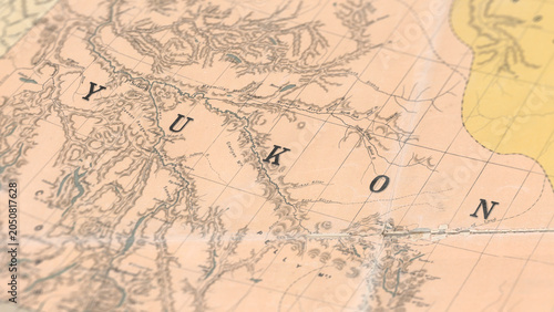 Bilde på lerret Macro View of Vintage Map Highlighting Yukon Canada with Detailed Geographic Car