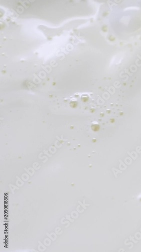 milk surface texture with bubbles close up macro background