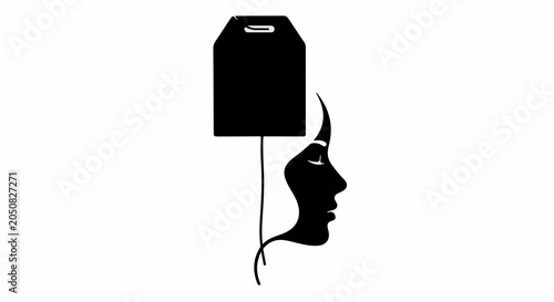 Abstract concept of a woman's profile silhouette with a tea bag representing contemplation or relaxation