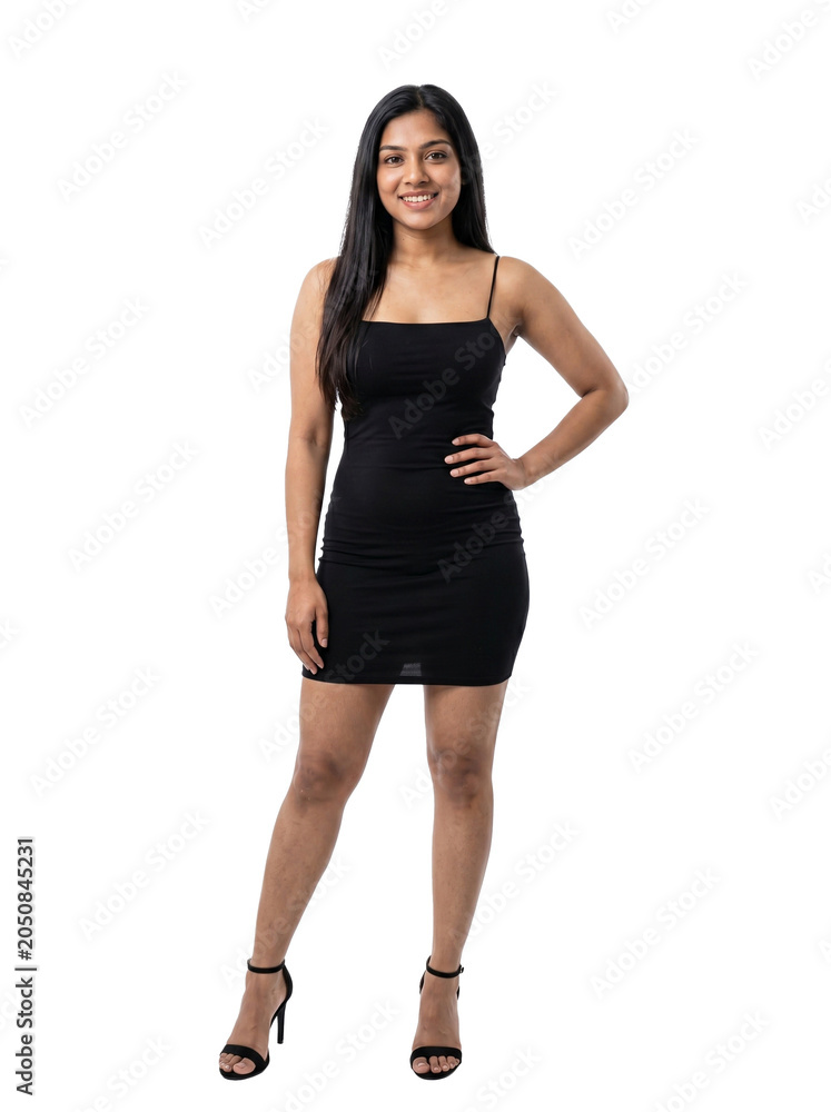 Fototapeta premium Woman wearing black dress standing with one hand on hip