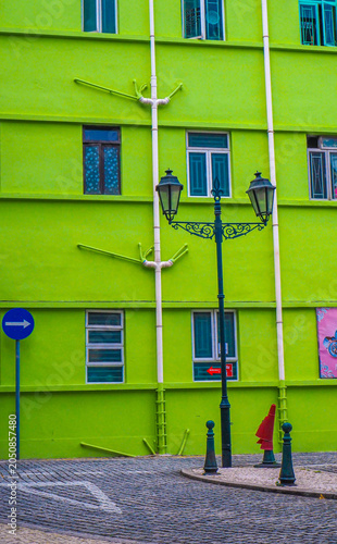 Vibrant Green Urban Architecture With Vintage Street Lamps