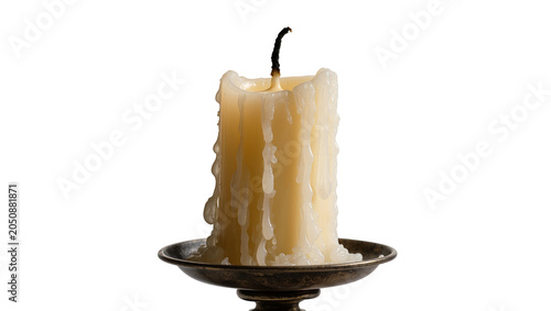 Foto Thick drippy wax candle on antique holder