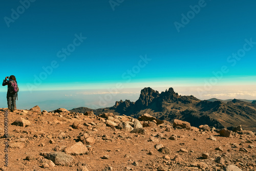 Hiker Taking Photos of Majestic Peaks and Alpine Desert Landscape on the Nival Ecological Zone in Mount Kenya, Mount Kenya National Park, Kenya