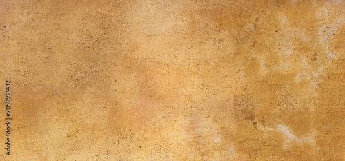 Bild auf Leinwand Full frame view of a rustic yellow cement wall background texture with an aged, weathered and dirty grunge surface look