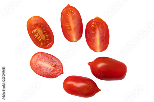 Red small cherry tomatoes whole and halved isolated on white background. clipping path, top view