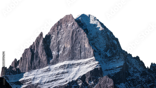 Fotografie Jagged rocky mountain peak with snow patches