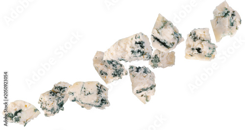 Bild auf Leinwand Abstractly chopped pieces of blue cheese fly through space, forming a chain shape