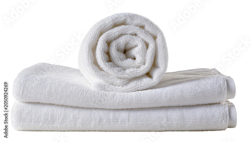 Stack of fluffy white bath towels rolled and folded