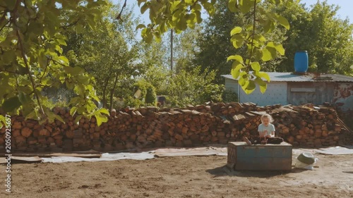 A child playing with a doll in nature, playing with a doll, a girl with a doll