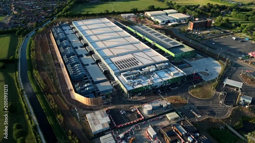 High-angle drone perspective looking down at the massive external cooling infrastructure of a modern technology data centre near London