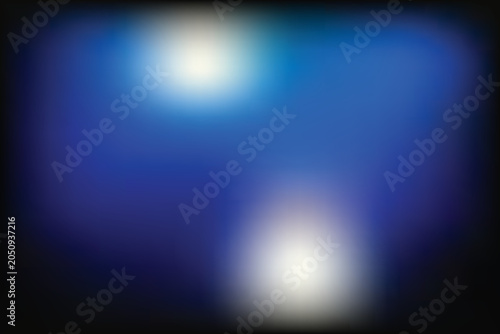 Blurry image of glowing white lights on a blue transparent background at night