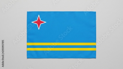National flag of Aruba with light blue field, yellow stripes, and red star outlined in white, design symbolizes sea, sky, abundance, heritage, and island identity.