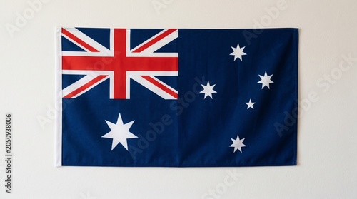 National flag of Australia with blue field, Union Jack, Commonwealth Star, and Southern Cross constellation, design symbolizes heritage, federation, and identity under southern skies.