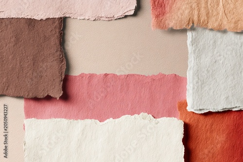 Collage background of overlapping pastel paper scraps texture for design