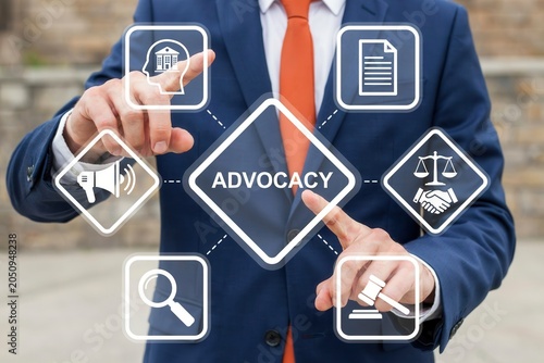 Businessman pushing button advocacy on touch screen concept of public support, legal defense, and lobbying