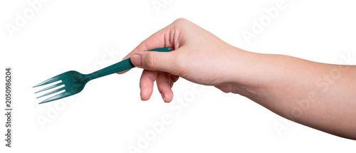 Female hand holding a green plastic fork isolated on white background.