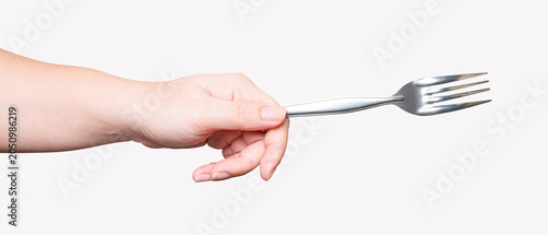 Female hand holding a black plastic fork isolated on white background.