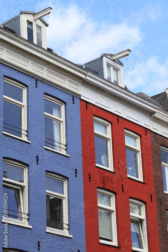 Blue and Red House Facades with Dormers in Amsterdam, De Pijp Neighbourhood, Netherlands