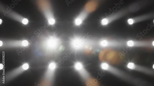 Bright White Stage Lights Matrix Flashing With Lens Flare Animation On Black Background