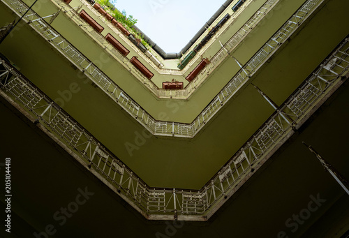 фотографія Looking skyward in the courtyard of an Art Nouveau building in Budapest's Jewish Quarter, Hungary