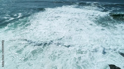 Aerial view of waves crashing on rocks The Concept of power