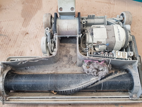 Disassembled Dusty Vacuum Cleaner Parts