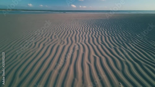 serene ocean waves rolling under clear blue sky timelapse