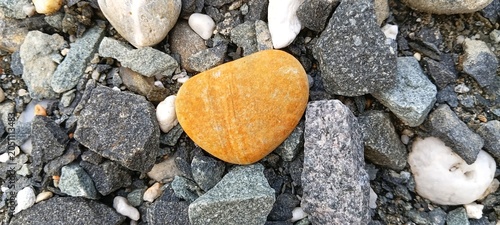 Fotografie A collection of heart-shaped river stones naturally formed by water erosion, pro