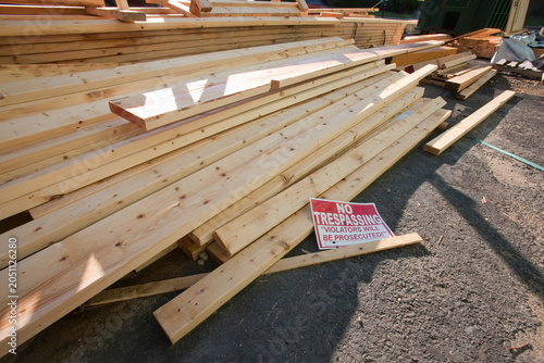 No Trespassing sign on pile of boards