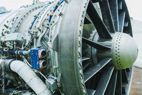 фотографія Close view of a large aircraft jet engine with complex components, taken at an a