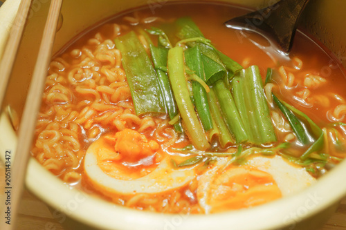Close-up of Spicy Ramen with Soft-Boiled Egg and Green Onions