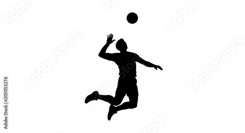 Silhouette of a man playing volleyball with the ball above his head