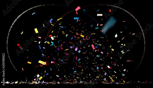 Colorful confetti explosion against a black background, illuminated by a soft, diffused spotlight in an artistic composition
