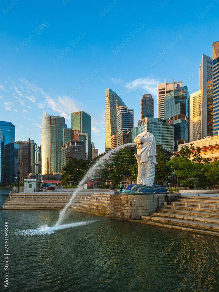 Obraz premium February 6, 2020: Merlion Statue, the official mascot of Singapore, at Marina Bay in Singapore. It is a mythical creature with a lion head and the body of a fish widely used to represent the city