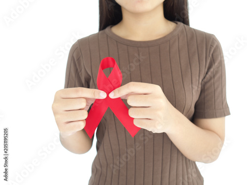 Woman holding red ribbon sign cancer.