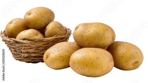 Canvas-taulu Heap of fresh potatoes in woven basket and scattered