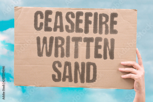 Schilderij op canvas "Ceasefire written sand" Truce agreement not lasting