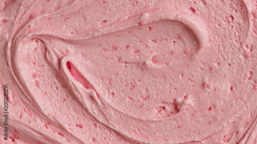 Strawberry gelato or ice cream texture background with rich pastel pink color  smooth creamy pattern  and natural berry fragments